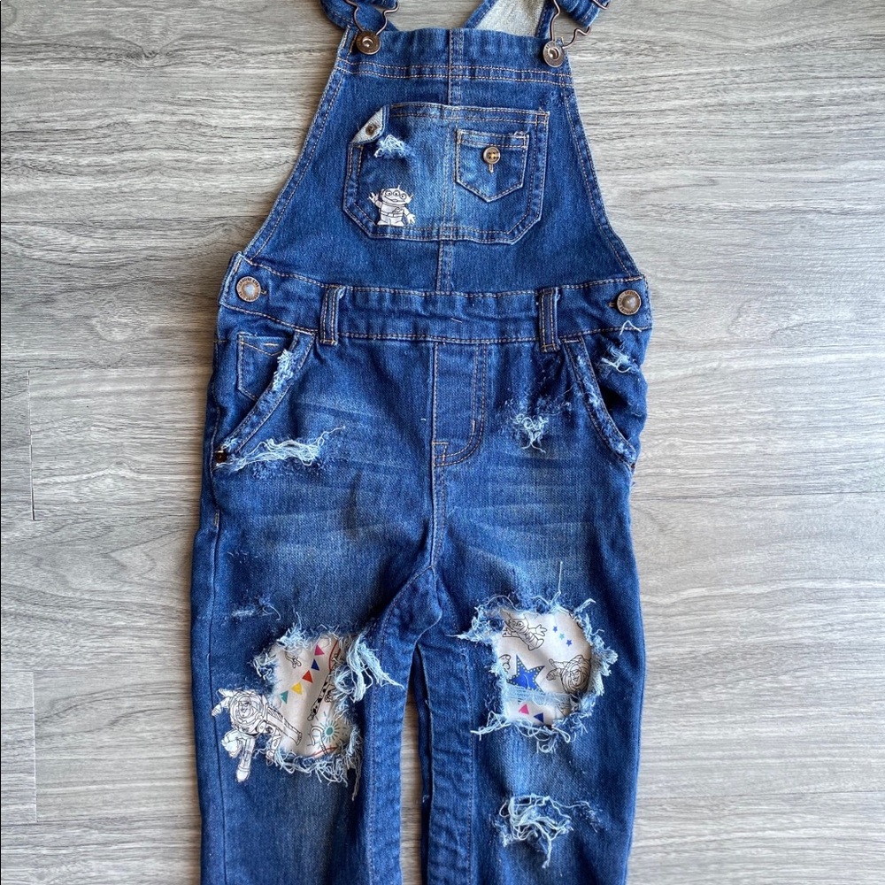 Distressed toy story overalls